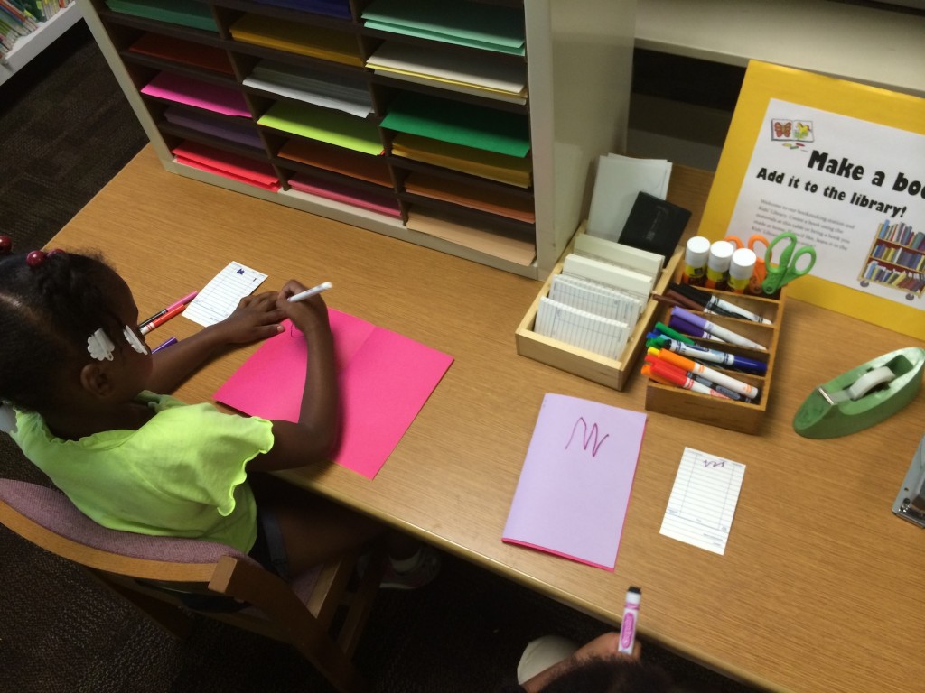 patrons utilizing bookmaking station